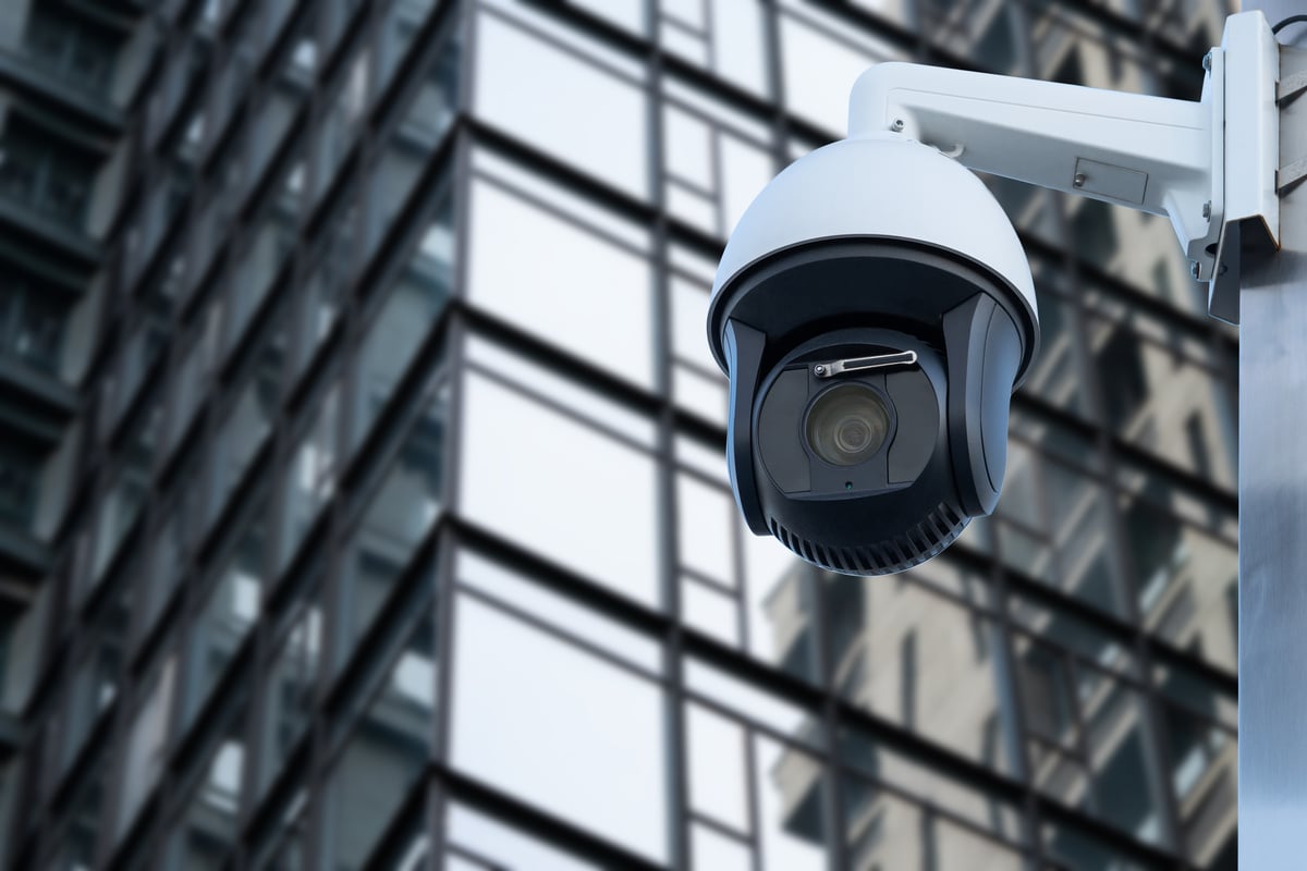 Security CCTV camera in office building. Blurred background.